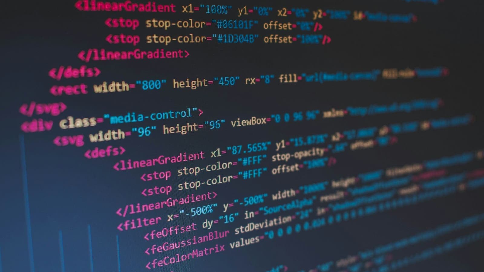 Close-up of colourful HTML and SVG code on a screen